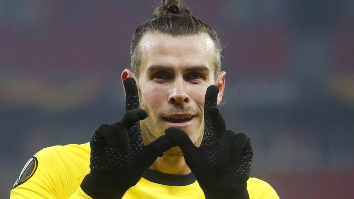 Tottenhams Gareth Bale celebrates after scoring his sides second goal during the Europa League round of 32, first leg, soccer match between Wolfsberger AC and Tottenham Hotspur at the Puskas Arena stadium in Budapest, Hungary, Thursday, Feb. 18, 2021. (AP Photo/Laszlo Balogh)
