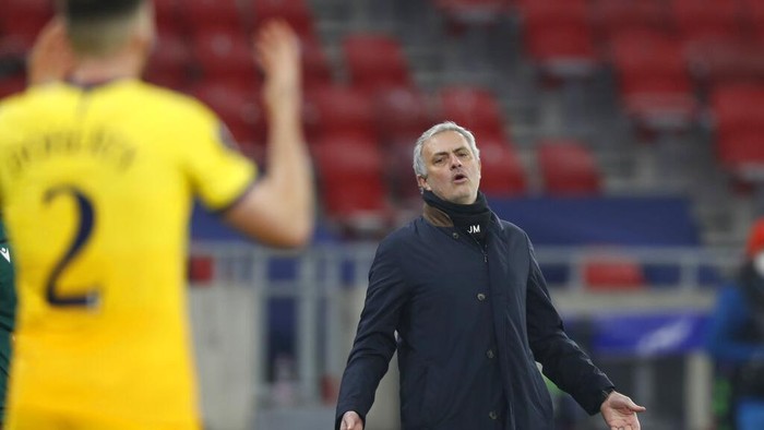 Tottenhams manager Jose Mourinho gestures during the Europa League round of 32, first leg, soccer match between Wolfsberger AC and Tottenham Hotspur at the Puskas Arena stadium in Budapest, Hungary, Thursday, Feb. 18, 2021. (AP Photo/Laszlo Balogh)