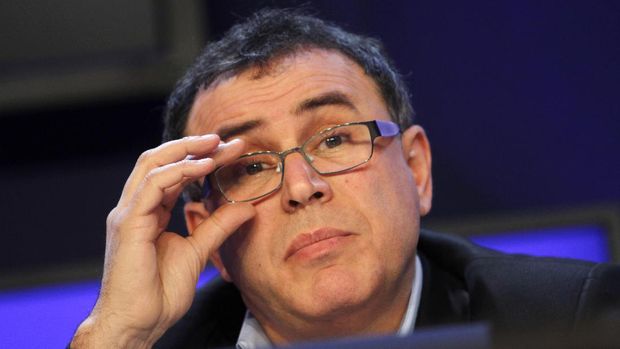Professor of Economics, Leonard N. Stern School, NYU, USA, Nouriel Roubini adjusts his glasses during a session at the World Economic Forum in Davos, Switzerland on Wednesday, Jan. 26, 2011. Buoyed by a burst of optimism about the global economy and mindful of the