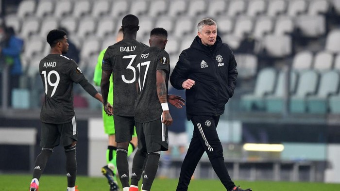 TURIN, ITALY - FEBRUARY 18: Fred of Manchester United and Ole Gunnar Solskjær, Manager of Manchester United interact following the UEFA Europa League Round of 32 match between Real Sociedad and Manchester United at Allianz Stadium on February 18, 2021 in Turin, Italy. Real Sociedad face Manchester United at a neutral venue in Turin behind closed doors after Spain imposed a ban on travellers arriving from the UK in an effort to prevent the spread of Covid-19 variants. (Photo by Valerio Pennicino/Getty Images)