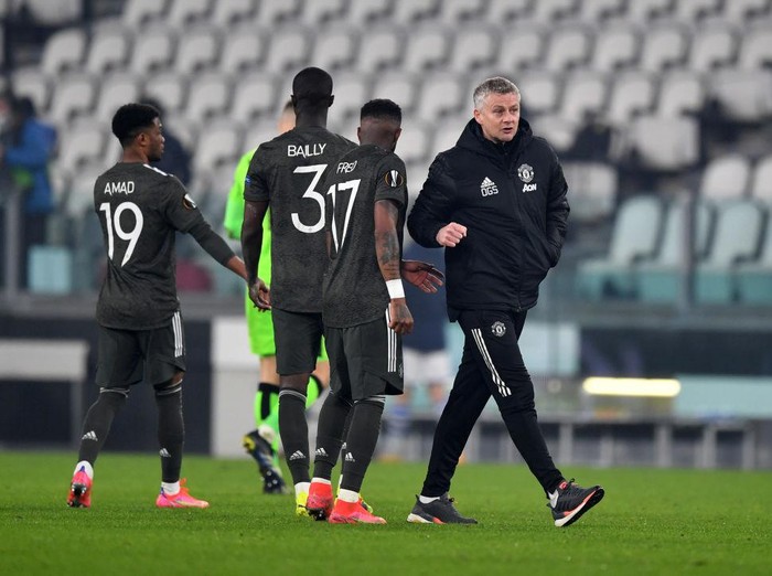 TURIN, ITALY - FEBRUARY 18: Fred of Manchester United and Ole Gunnar Solskjær, Manager of Manchester United interact following the UEFA Europa League Round of 32 match between Real Sociedad and Manchester United at Allianz Stadium on February 18, 2021 in Turin, Italy. Real Sociedad face Manchester United at a neutral venue in Turin behind closed doors after Spain imposed a ban on travellers arriving from the UK in an effort to prevent the spread of Covid-19 variants. (Photo by Valerio Pennicino/Getty Images)