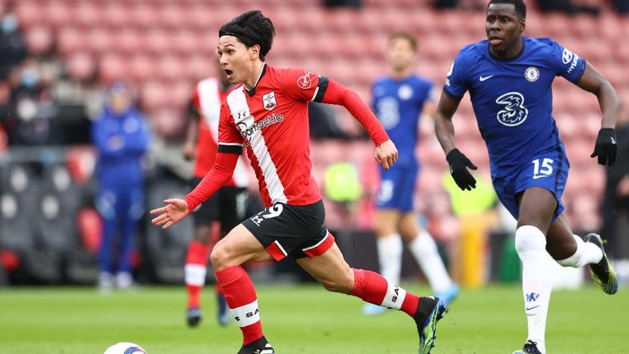 SOUTHAMPTON, ENGLAND - FEBRUARY 20: Takumi Minamino of Southampton on his way to scoring his teams first goal during the Premier League match between Southampton and Chelsea at St Marys Stadium on February 20, 2021 in Southampton, England. Sporting stadiums around the UK remain under strict restrictions due to the Coronavirus Pandemic as Government social distancing laws prohibit fans inside venues resulting in games being played behind closed doors. (Photo by Michael Steele/Getty Images)