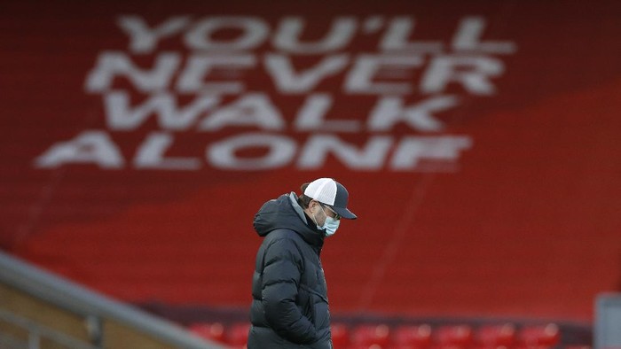 Liverpools manager Jurgen Klopp walks on the pitch ahead of the English Premier League soccer match between Liverpool and Everton at Anfield in Liverpool, England, Saturday, Feb. 20, 2021. (Phil Noble/ Pool via AP)