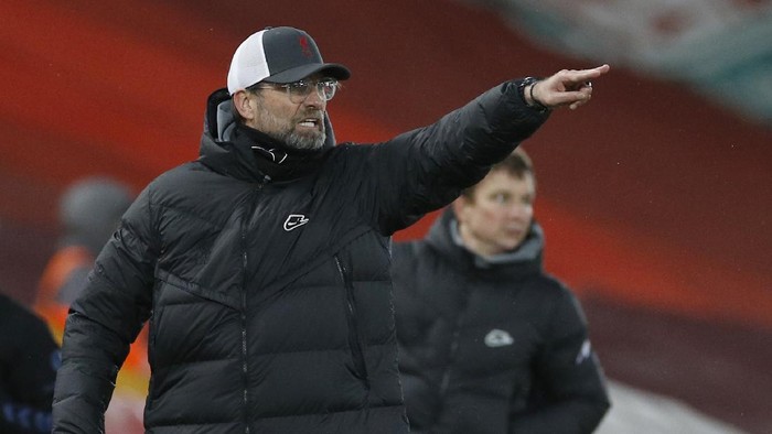 Liverpools manager Jurgen Klopp gestures to his players during the English Premier League soccer match between Liverpool and Everton at Anfield in Liverpool, England, Saturday, Feb. 20, 2021. (Phil Noble/ Pool via AP)