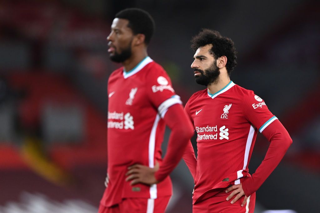 LIVERPOOL, ENGLAND - FEBRUARY 20: Georginio Wijnaldum of Liverpool and Mohamed Salah of Liverpool look dejected after conceding a second goal during the Premier League match between Liverpool and Everton at Anfield on February 20, 2021 in Liverpool, England. Sporting stadiums around the UK remain under strict restrictions due to the Coronavirus Pandemic as Government social distancing laws prohibit fans inside venues resulting in games being played behind closed doors. (Photo by Laurence Griffiths/Getty Images)