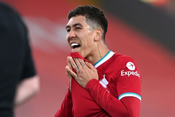 LIVERPOOL, ENGLAND - FEBRUARY 20: Roberto Firmino of Liverpool reacts as his team concede a penalty during the Premier League match between Liverpool and Everton at Anfield on February 20, 2021 in Liverpool, England. Sporting stadiums around the UK remain under strict restrictions due to the Coronavirus Pandemic as Government social distancing laws prohibit fans inside venues resulting in games being played behind closed doors. (Photo by Laurence Griffiths/Getty Images)