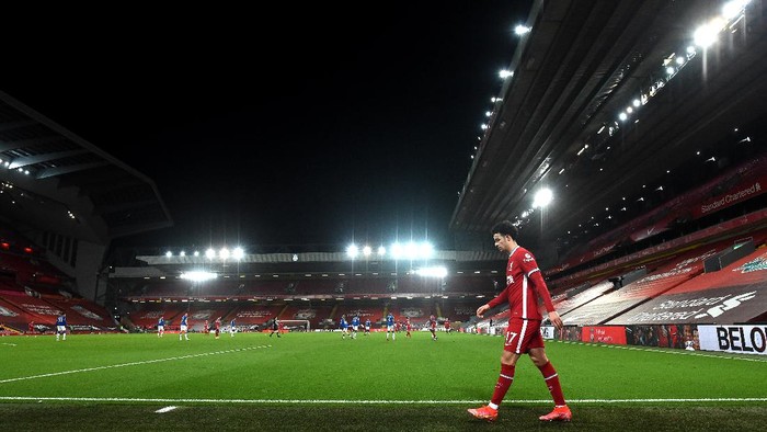 LIVERPOOL, ENGLAND - FEBRUARY 20: Curtis Jones of Liverpool leaves the pitch as he is substituted off during the Premier League match between Liverpool and Everton at Anfield on February 20, 2021 in Liverpool, England. Sporting stadiums around the UK remain under strict restrictions due to the Coronavirus Pandemic as Government social distancing laws prohibit fans inside venues resulting in games being played behind closed doors. (Photo by Paul Ellis - Pool/Getty Images)