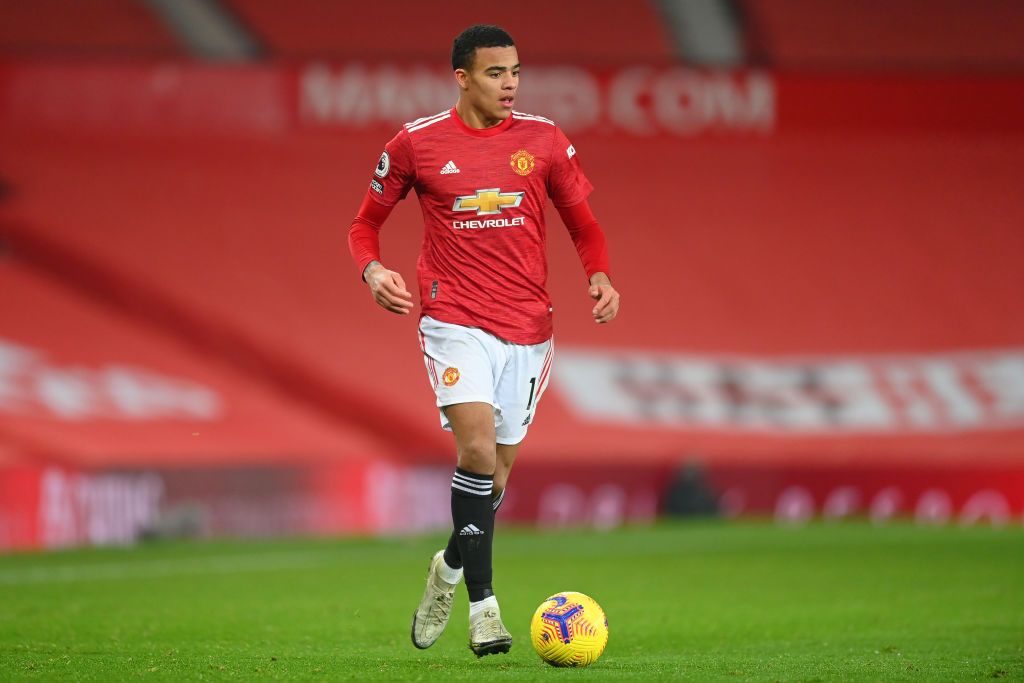 MANCHESTER, ENGLAND - DECEMBER 29: Mason Greenwood of Manchester United in action during the Premier League match between Manchester United and Wolverhampton Wanderers at Old Trafford on December 29, 2020 in Manchester, England. The match will be played without fans, behind closed doors as a Covid-19 precaution. (Photo by Michael Regan/Getty Images)