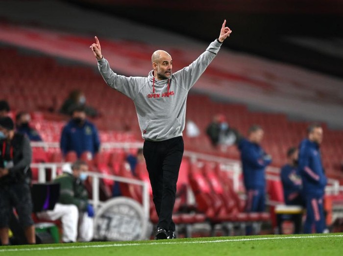 LONDON, ENGLAND - FEBRUARY 21: Pep Guardiola, Manager of Manchester City reacts during the Premier League match between Arsenal and Manchester City at Emirates Stadium on February 21, 2021 in London, England. Sporting stadiums around the UK remain under strict restrictions due to the Coronavirus Pandemic as Government social distancing laws prohibit fans inside venues resulting in games being played behind closed doors. (Photo by Shaun Botterill/Getty Images)