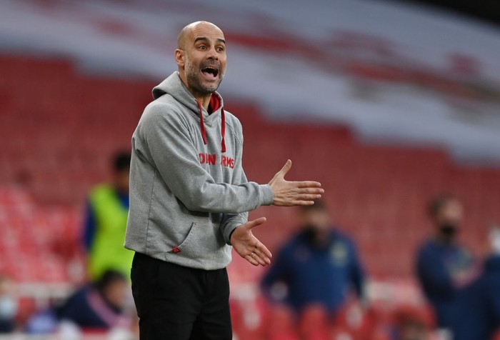 LONDON, ENGLAND - FEBRUARY 21: Pep Guardiola, Manager of Manchester City reacts during the Premier League match between Arsenal and Manchester City at Emirates Stadium on February 21, 2021 in London, England. Sporting stadiums around the UK remain under strict restrictions due to the Coronavirus Pandemic as Government social distancing laws prohibit fans inside venues resulting in games being played behind closed doors. (Photo by Shaun Botterill/Getty Images)