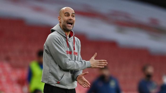 Pep Guardiola LONDON, ENGLAND - FEBRUARY 21: Pep Guardiola, Manager of Manchester City reacts during the Premier League match between Arsenal and Manchester City at Emirates Stadium on February 21, 2021 in London, England. Sporting stadiums around the UK remain under strict restrictions due to the Coronavirus Pandemic as Government social distancing laws prohibit fans inside venues resulting in games being played behind closed doors. (Photo by Shaun Botterill/Getty Images)
