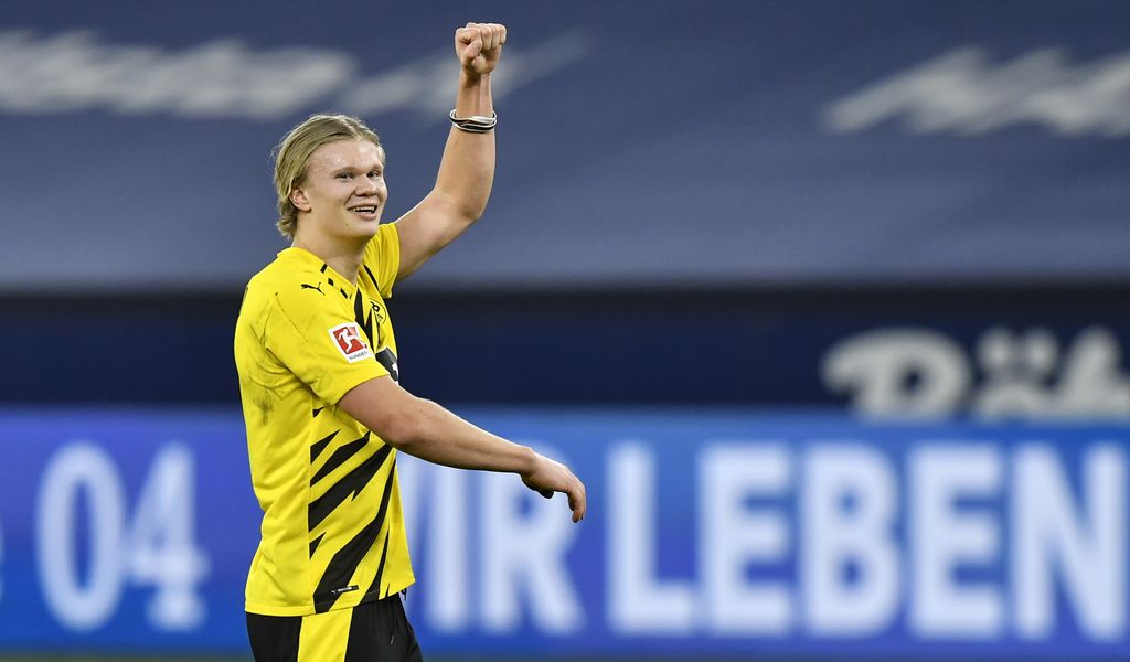Dortmund's scorer Erling Haaland celebrates after winning the German Bundesliga soccer match between FC Schalke 04 and Borussia Dortmund in Gelsenkirchen, Germany, Saturday, Feb. 20, 2021. (AP Photo/Martin Meissner, Pool)