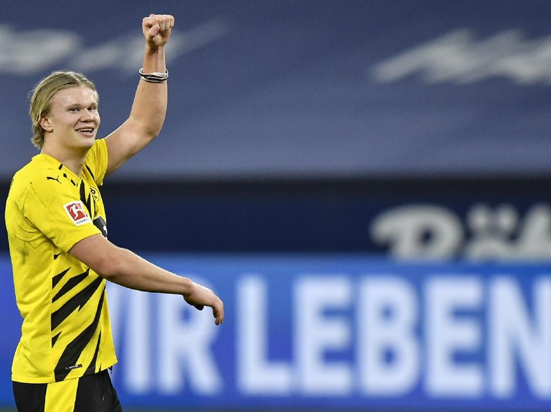 Dortmund's scorer Erling Haaland celebrates after winning the German Bundesliga soccer match between FC Schalke 04 and Borussia Dortmund in Gelsenkirchen, Germany, Saturday, Feb. 20, 2021. (AP Photo/Martin Meissner, Pool)