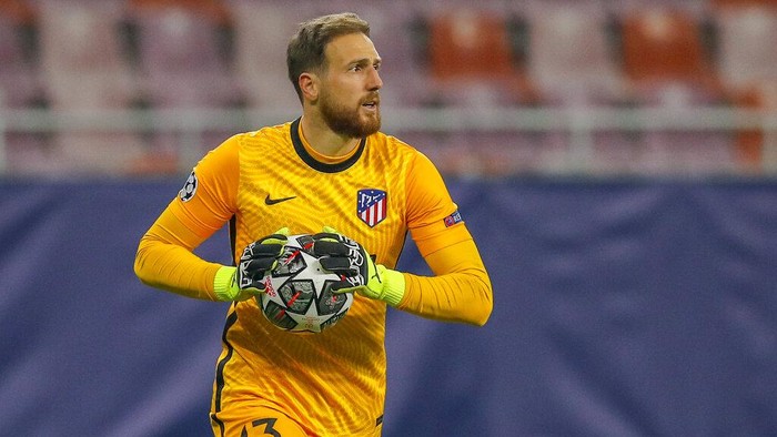 Atletico Madrids goalkeeper Jan Oblak holds the ball during the Champions League, round of 16, first leg soccer match between Atletico Madrid and Chelsea at the National Arena stadium in Bucharest, Romania, Tuesday, Feb. 23, 2021. (AP Photo/Vadim Ghirda)