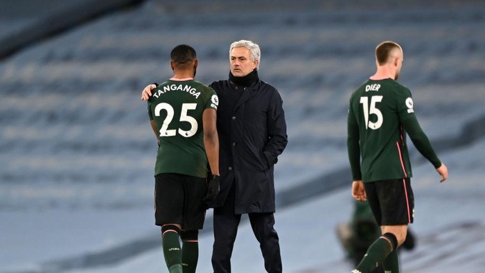 MANCHESTER, ENGLAND - FEBRUARY 13: Jose Mourinho, Manager of Tottenham Hotspur embraces Japhet Tanganga of Tottenham Hotspur following the Premier League match between Manchester City and Tottenham Hotspur at Etihad Stadium on February 13, 2021 in Manchester, England. Sporting stadiums around the UK remain under strict restrictions due to the Coronavirus Pandemic as Government social distancing laws prohibit fans inside venues resulting in games being played behind closed doors. (Photo by Shaun Botterill/Getty Images)