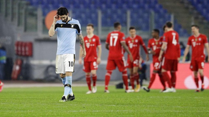 Lazios Luis Alberto reacts after his teammate Lazios Francesco Acerbi scored an own goal during the Champions League round of 16 first leg soccer match between Lazio and Bayern Munich at the Olympic stadium in Rome, Tuesday, Feb. 23, 2021. (AP Photo/Gregorio Borgia)