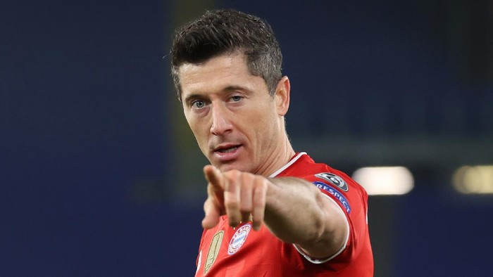 ROME, ITALY - FEBRUARY 23: Robert Lewandowski of FC Bayern Muenchen celebrates after scoring their sides first goal during the UEFA Champions League Round of 16 match between Lazio Roma and Bayern München at Olimpico Stadium on February 23, 2021 in Rome, Italy. Sporting stadiums around Italy remain under strict restrictions due to the Coronavirus Pandemic as Government social distancing laws prohibit fans inside venues resulting in games being played behind closed doors. (Photo by Alexander Hassenstein/Getty Images)