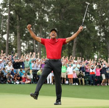 FILE PHOTO: Golf - Masters - Augusta National Golf Club - Augusta, Georgia, U.S. - April 14, 2019. Tiger Woods of the U.S. celebrates on the 18th hole to win the 2019 Masters. REUTERS/Lucy Nicholson/File Photo