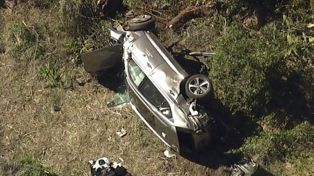 In this aerial image take from video provided by KABC-TV video, a vehicle rest on its side after a rollover accident involving golfer Tiger Woods along a road in the Rancho Palos Verdes section of Los Angeles on Tuesday, Feb. 23, 2021. Woods had to be extricated from the vehicle with the 