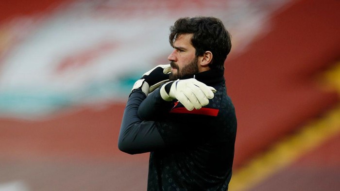 LIVERPOOL, ENGLAND - FEBRUARY 20: Alisson of Liverpool warms up prior to the Premier League match between Liverpool and Everton at Anfield on February 20, 2021 in Liverpool, England. Sporting stadiums around the UK remain under strict restrictions due to the Coronavirus Pandemic as Government social distancing laws prohibit fans inside venues resulting in games being played behind closed doors. (Photo by Phil Noble - Pool/Getty Images)
