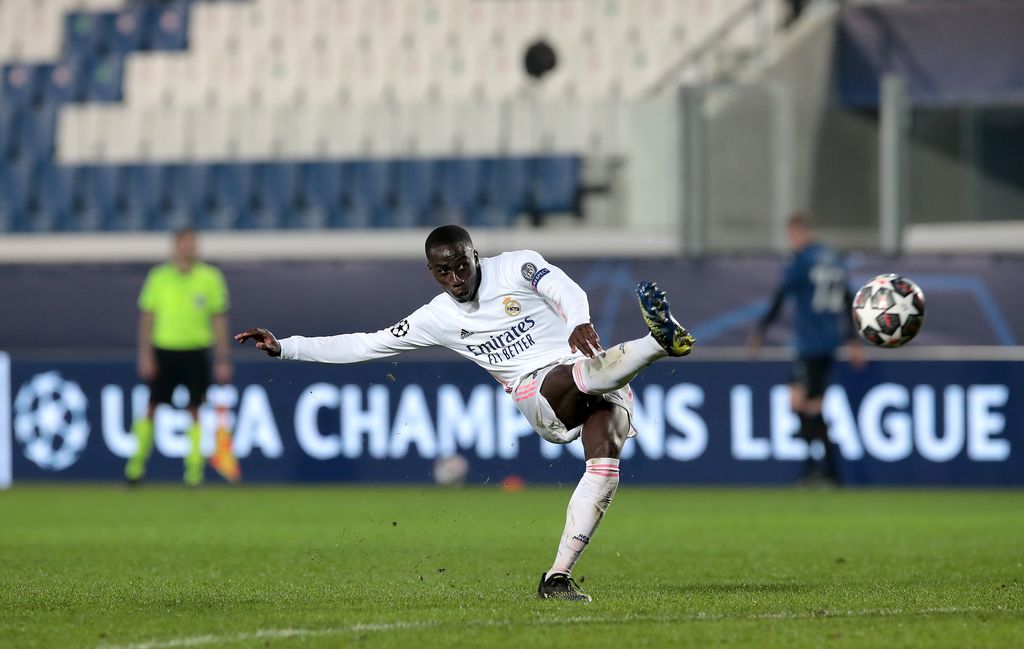 BERGAMO, ITALY - FEBRUARY 24: Ferland Mendy of Real Madrid scores their side's first goal during the UEFA Champions League Round of 16 match between Atalanta and Real Madrid at Gewiss Stadium on February 24, 2021 in Bergamo, Italy. Sporting stadiums around Italy remain under strict restrictions due to the Coronavirus Pandemic as Government social distancing laws prohibit fans inside venues resulting in games being played behind closed doors. (Photo by Emilio Andreoli/Getty Images)