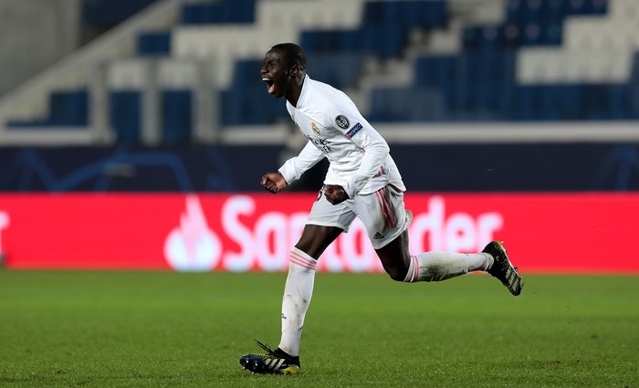 BERGAMO, ITALY - FEBRUARY 24: Ferland Mendy of Real Madrid celebrates after scoring their sides first goal during the UEFA Champions League Round of 16 match between Atalanta and Real Madrid at Gewiss Stadium on February 24, 2021 in Bergamo, Italy. Sporting stadiums around Italy remain under strict restrictions due to the Coronavirus Pandemic as Government social distancing laws prohibit fans inside venues resulting in games being played behind closed doors. (Photo by Emilio Andreoli/Getty Images)