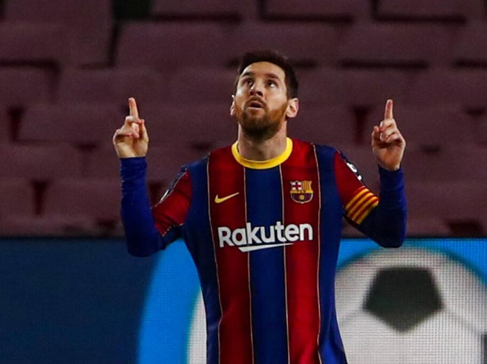 Barcelona's Lionel Messi celebrates after scoring the opening goal during the Spanish La Liga soccer match between FC Barcelona and Elche at the Camp Nou stadium in Barcelona, Spain, Wednesday, Feb. 24, 2021. (AP Photo/Joan Monfort)