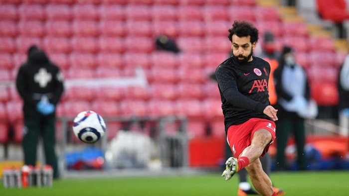 LIVERPOOL, ENGLAND - FEBRUARY 20: Mohamed Salah of Liverpool warms up prior to the Premier League match between Liverpool and Everton at Anfield on February 20, 2021 in Liverpool, England. Sporting stadiums around the UK remain under strict restrictions due to the Coronavirus Pandemic as Government social distancing laws prohibit fans inside venues resulting in games being played behind closed doors. (Photo by Paul Ellis - Pool/Getty Images)
