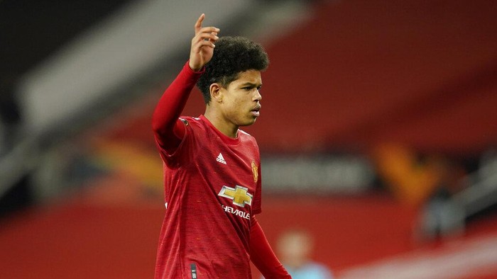 Manchester United's Shola Shoretire gestures during the Europa League round of 32, second leg, soccer match between Manchester United and Real Sociedad at Old Trafford in Manchester, England, Thursday, Feb. 25, 2021. (AP Photo/Dave Thompson)