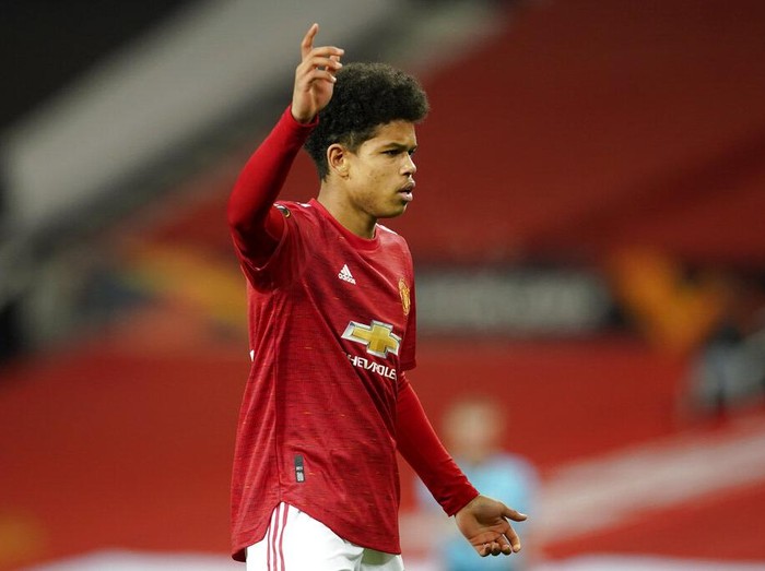 Manchester United's Shola Shoretire gestures during the Europa League round of 32, second leg, soccer match between Manchester United and Real Sociedad at Old Trafford in Manchester, England, Thursday, Feb. 25, 2021. (AP Photo/Dave Thompson)