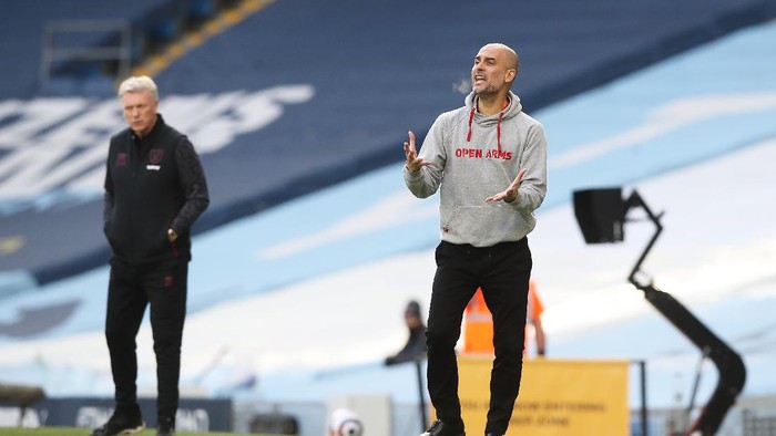 MANCHESTER, ENGLAND - FEBRUARY 27: Pep Guardiola, Manager of Manchester City reacts during the Premier League match between Manchester City and West Ham United at Etihad Stadium on February 27, 2021 in Manchester, England. Sporting stadiums around the UK remain under strict restrictions due to the Coronavirus Pandemic as Government social distancing laws prohibit fans inside venues resulting in games being played behind closed doors. (Photo by Martin Rickett - Pool/Getty Images)