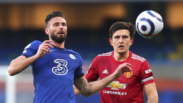 Chelsea's Olivier Giroud, left, and Manchester United's Harry Maguire challenge for the ball during the English Premier League soccer match between Chelsea and Manchester United at Stamford Bridge Stadium in London, England, Sunday, Feb. 28, 2021. (Clive Rose/Pool via AP)