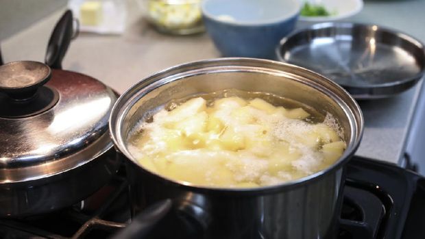 Preparations for making dinner.  Boiling potatoes for mashed potatoes for dinner.