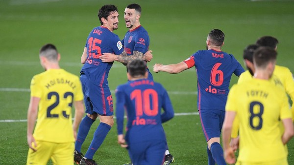 VILLAREAL, SPAIN - FEBRUARY 28: Stefan Savic of Atletico de Madrid celebrates with team mates after scoring their sides first goal during the La Liga Santander match between Villarreal CF and Atletico de Madrid at Estadio de la Ceramica on February 28, 2021 in Villareal, Spain. Sporting stadiums around Spain remain under strict restrictions due to the Coronavirus Pandemic as Government social distancing laws prohibit fans inside venues resulting in games being played behind closed doors. (Photo by Alex Caparros/Getty Images)