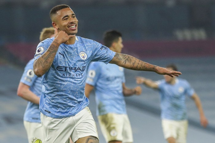 Manchester Citys Gabriel Jesus celebrates after scoring his team second goal during the English Premier League soccer match between Manchester City and Wolves at the Etihad stadium in Manchester, England, Tuesday, March 2, 2021. (Carl Recine/Pool via AP)