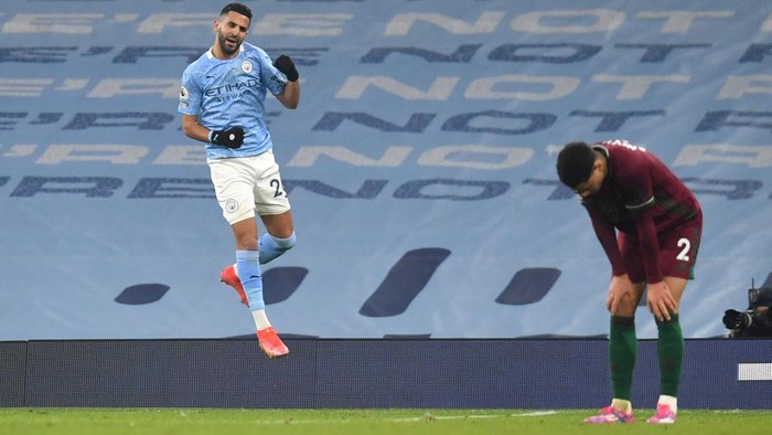 MANCHESTER, ENGLAND - MARCH 02: Riyad Mahrez of Manchester City celebrates after scoring their sides third goal during the Premier League match between Manchester City and Wolverhampton Wanderers at Etihad Stadium on March 02, 2021 in Manchester, England. Sporting stadiums around the UK remain under strict restrictions due to the Coronavirus Pandemic as Government social distancing laws prohibit fans inside venues resulting in games being played behind closed doors. (Photo by Paul Ellis - Pool/Getty Images)