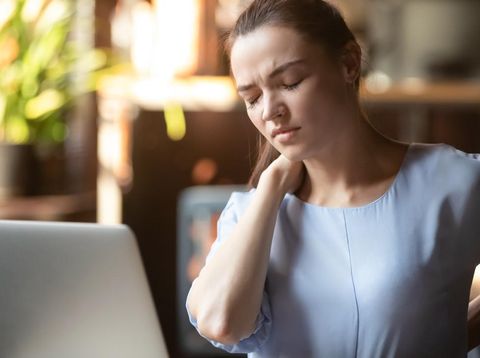 Stressed upset business woman feeling backpain working on laptop sitting in incorrect posture, tired fatigued student rub back suffer from spine muscular pain injury lumbar backache concept in office