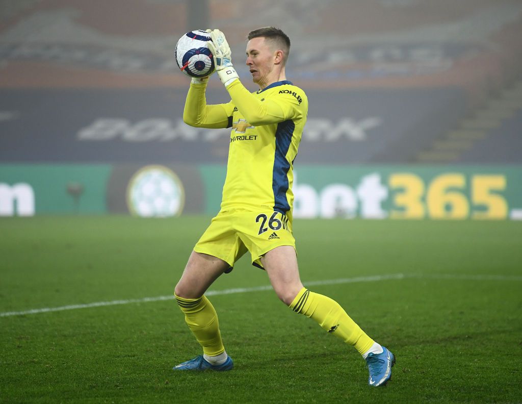 LONDON, ENGLAND - MARCH 03: Dean Henderson of Manchester United makes a save during the Premier League match between Crystal Palace and Manchester United at Selhurst Park on March 03, 2021 in London, England. Sporting stadiums around the UK remain under strict restrictions due to the Coronavirus Pandemic as Government social distancing laws prohibit fans inside venues resulting in games being played behind closed doors. (Photo by Mike Hewitt/Getty Images)