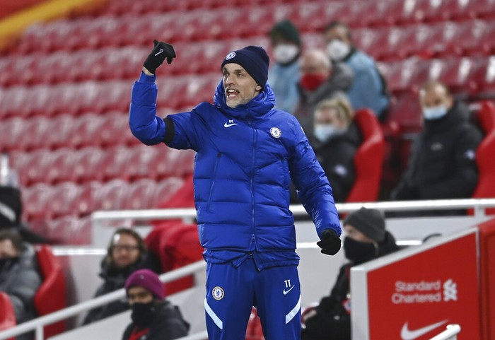 Chelseas head coach Thomas Tuchel gives instructions during the English Premier League soccer match between Liverpool and Chelsea at Anfield stadium in Liverpool, England, Thursday, March 4, 2021. (Laurence Griffiths, Pool via AP)