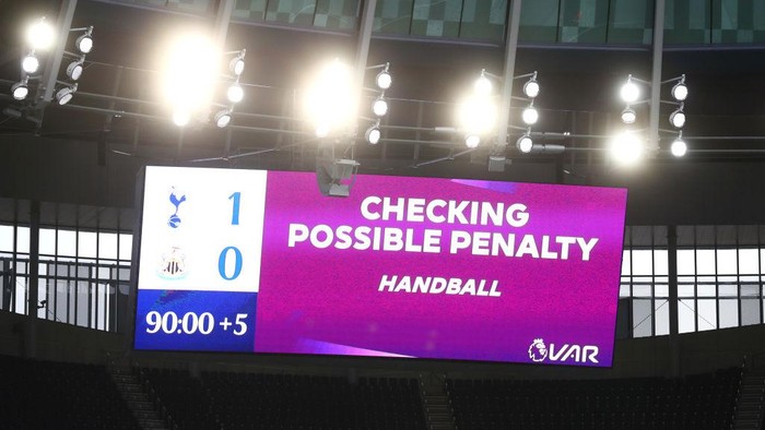 LONDON, ENGLAND - SEPTEMBER 27: The LED screen inside the stadium displays a sign informing about a VAR review for handball during the Premier League match between Tottenham Hotspur and Newcastle United at Tottenham Hotspur Stadium on September 27, 2020 in London, England. Sporting stadiums around the UK remain under strict restrictions due to the Coronavirus Pandemic as Government social distancing laws prohibit fans inside venues resulting in games being played behind closed doors. (Photo by Clive Rose/Getty Images)