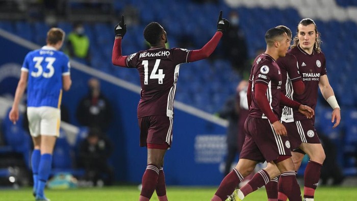 BRIGHTON, ENGLAND - MARCH 06: Kelechi Iheanacho of Leicester City  celebrates after scoring their teams first goal  during the Premier League match between Brighton & Hove Albion and Leicester City at American Express Community Stadium on March 06, 2021 in Brighton, England. Sporting stadiums around the UK remain under strict restrictions due to the Coronavirus Pandemic as Government social distancing laws prohibit fans inside venues resulting in games being played behind closed doors. (Photo by Neil Hall - Pool/Getty Images)