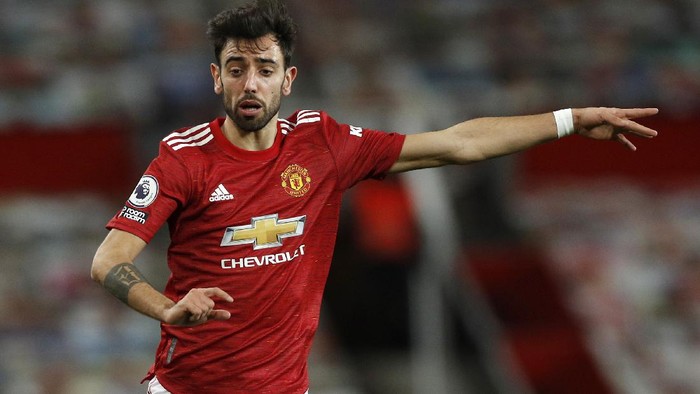 MANCHESTER, ENGLAND - FEBRUARY 21: Bruno Fernandes of Manchester United reacts during the Premier League match between Manchester United and Newcastle United at Old Trafford on February 21, 2021 in Manchester, England. Sporting stadiums around the UK remain under strict restrictions due to the Coronavirus Pandemic as Government social distancing laws prohibit fans inside venues resulting in games being played behind closed doors. (Photo by Phil Noble - Pool/Getty Images)