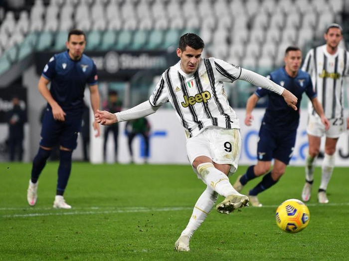 TURIN, ITALY - MARCH 06: Alvaro Morata of Juventus  celebrates with Adrien Rabiot  after scoring their team's third goal from the penalty spot during the Serie A match between Juventus  and SS Lazio at Allianz Stadium on March 06, 2021 in Turin, Italy. Sporting stadiums around Italy remain under strict restrictions due to the Coronavirus Pandemic as Government social distancing laws prohibit fans inside venues resulting in games being played behind closed doors. (Photo by Valerio Pennicino/Getty Images)