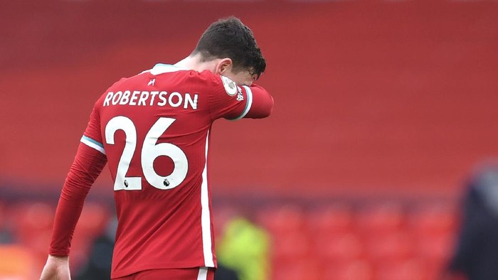 Liverpools Andrew Robertson reacts disappointed after the English Premier League soccer match between Liverpool and Fulham at Anfield stadium in Liverpool, England, Sunday, March 7, 2021. (Paul Ellis/Pool via AP)