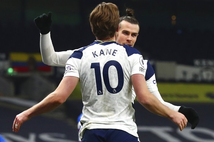 Tottenhams Gareth Bale, right, celebrates after scoring his sides opening goal with Tottenhams Harry Kane during the English Premier League soccer match between Tottenham Hotspur and Crystal Palace at the Tottenham Hotspur Stadium in London, Sunday, March 7, 2021. (Clive Rose/Pool via AP)