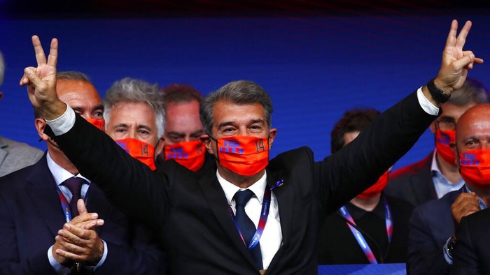Joan Laporta celebrates his victory after elections at the Camp Nou stadium in Barcelona, Spain, Sunday, March 7, 2021. Joan Laporta has been elected Barcelonas president on Sunday, inheriting a club mired in debt and facing daunting problems that include the possible departure of Messi when his contract ends at the end of the season. (AP Photo/Joan Monfort)