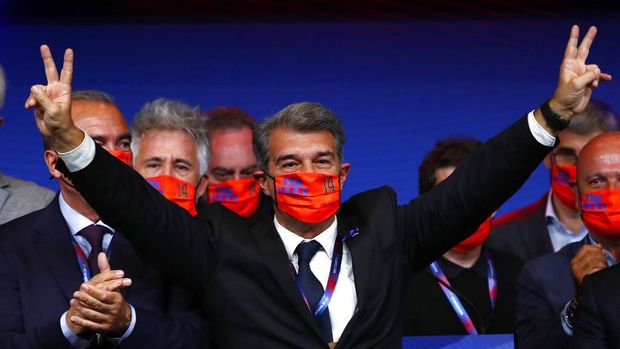 Joan Laporta celebrates his victory after elections at the Camp Nou stadium in Barcelona, Spain, Sunday, March 7, 2021. Joan Laporta has been elected Barcelona's president on Sunday, inheriting a club mired in debt and facing daunting problems that include the possible departure of Messi when his contract ends at the end of the season. (AP Photo/Joan Monfort)