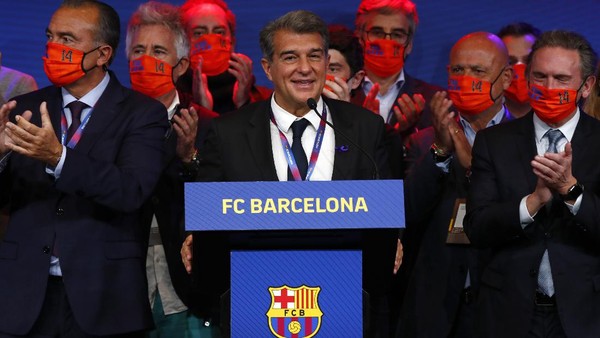 Joan Laporta, centre, celebrates his victory after elections at the Camp Nou stadium in Barcelona, Spain, Sunday, March 7, 2021. Joan Laporta has been elected Barcelonas president on Sunday, inheriting a club mired in debt and facing daunting problems that include the possible departure of Messi when his contract ends at the end of the season. (AP Photo/Joan Monfort)