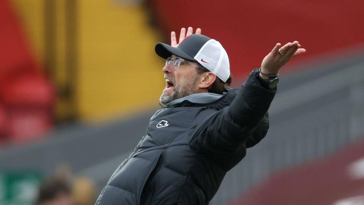 Klopp Vs Gary Neville Saat Bahas European Super League. Foto: (Getty Images/Clive Brunskill)