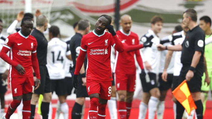 Liverpools Naby Keita reacts after the English Premier League soccer match between Liverpool and Fulham at Anfield stadium in Liverpool, England, Sunday, March 7, 2021. (Clive Brunskill/Pool via AP)
